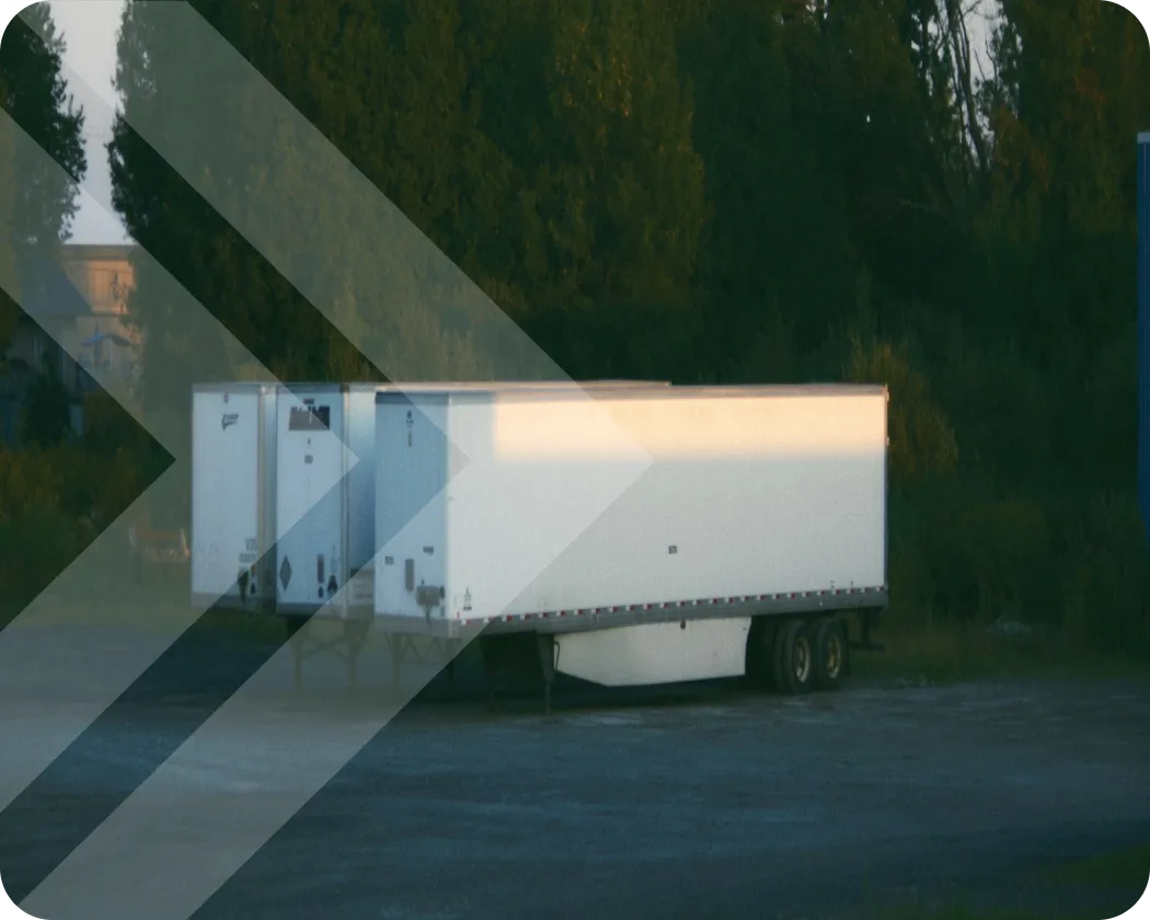 Drop trailers parked outside.