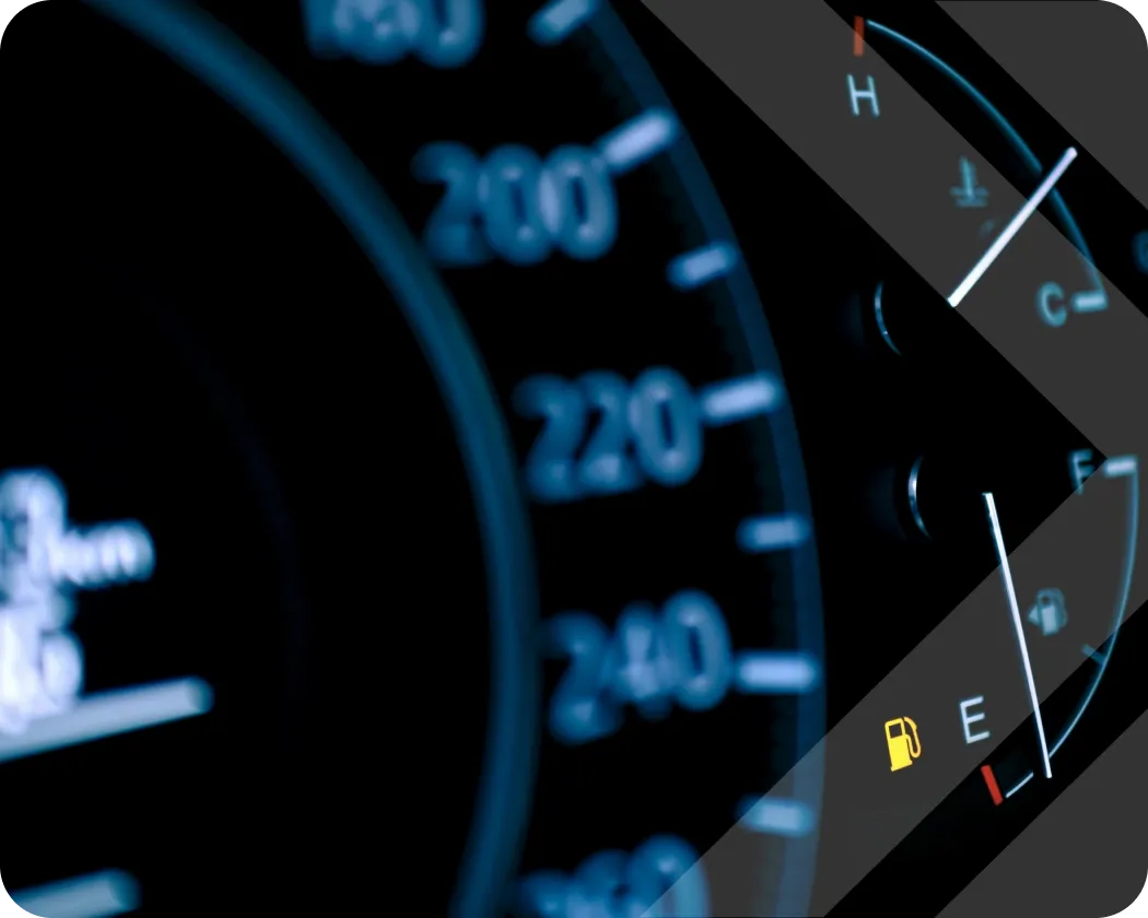 A close-up view of a fuel gauge nearing empty.