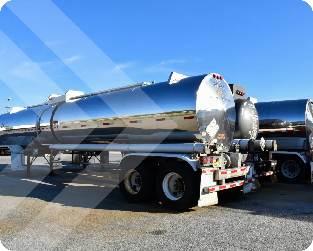 Several fuel tank trucks parked next to each other.
