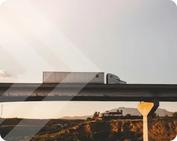 A semi truck driving on the highway.